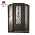 wrought iron and glass door with iron door handle